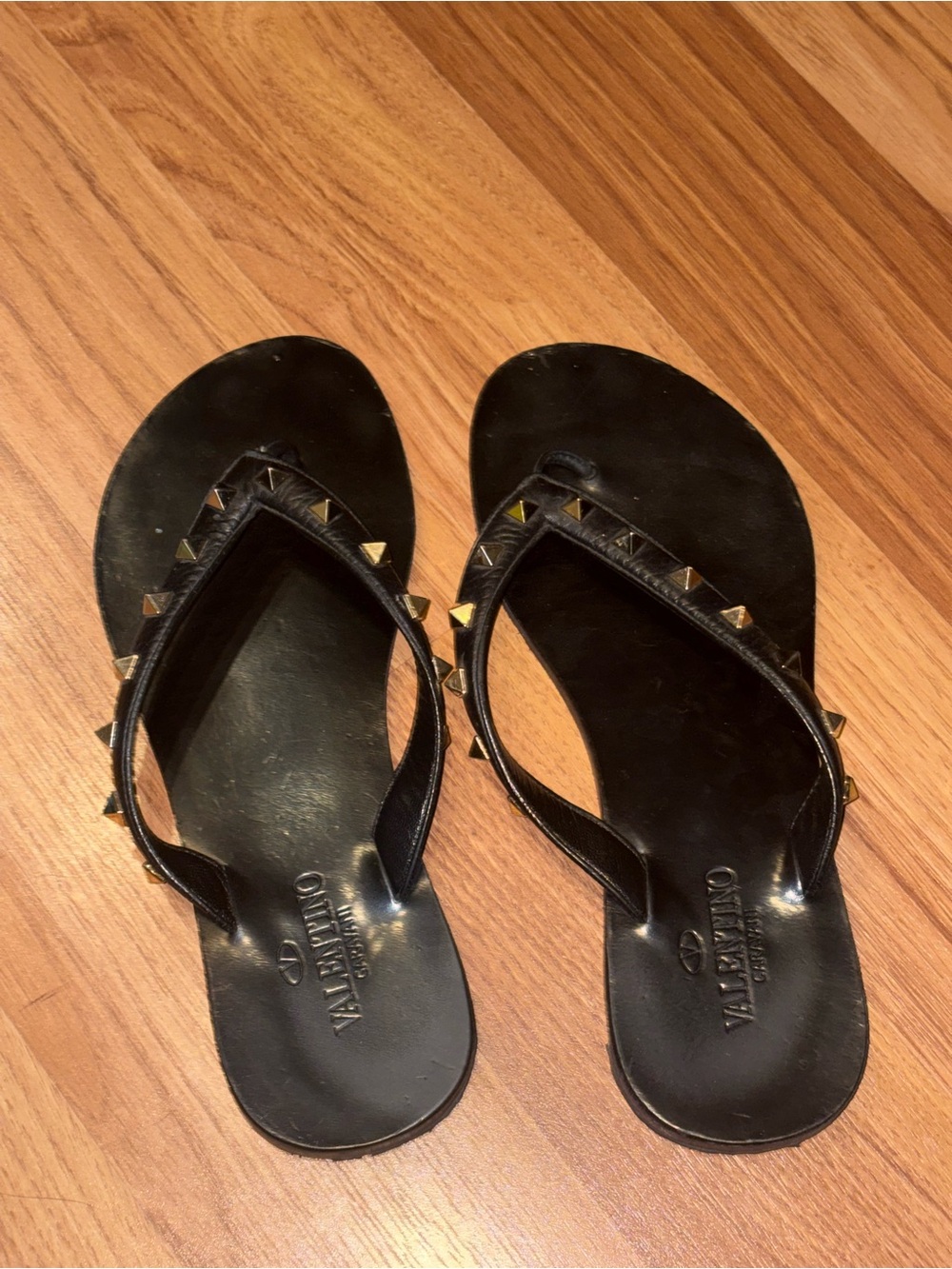 studded black flip flop sandals